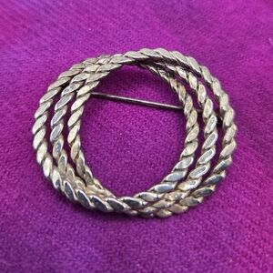 920. Silver-Tone Circle Brooch